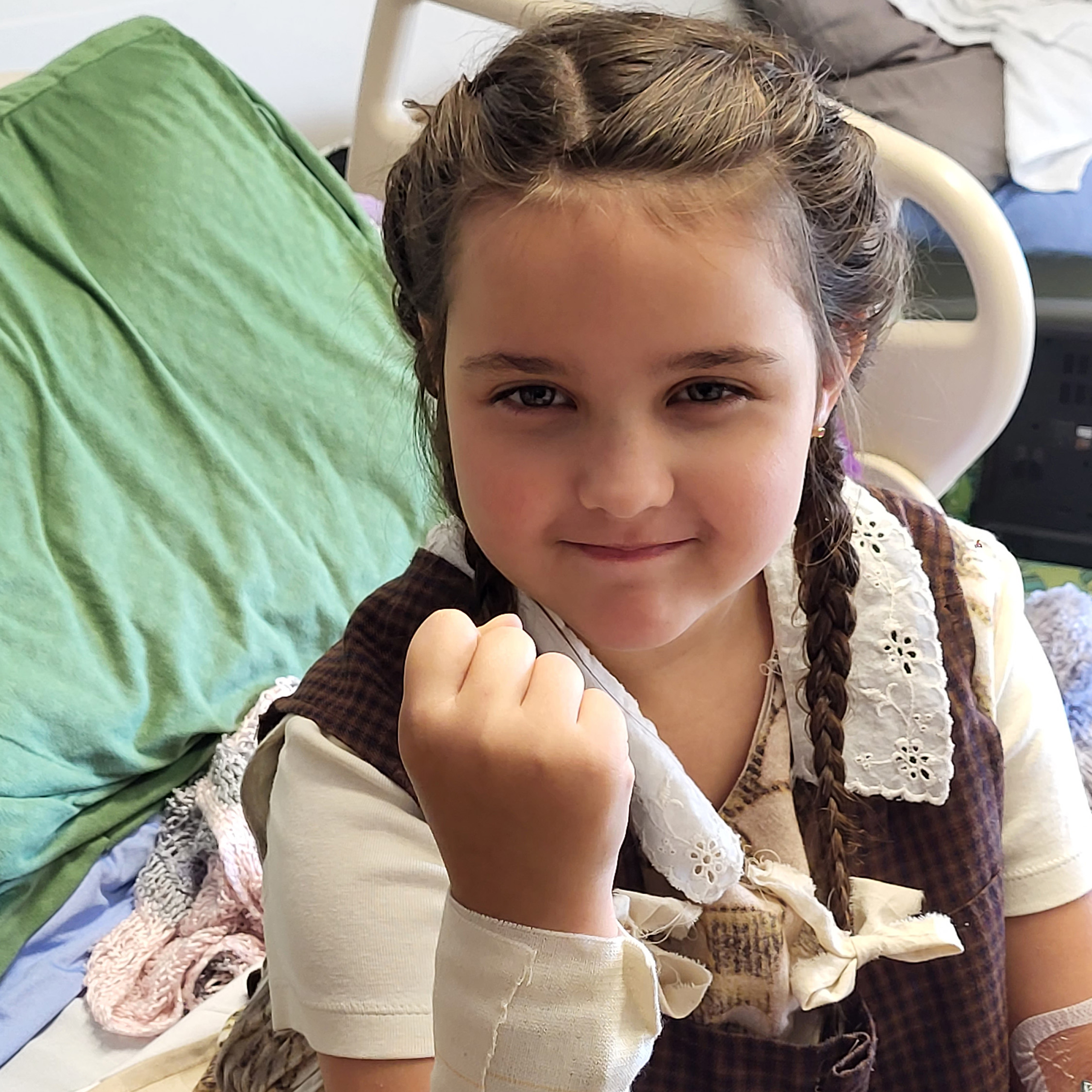 Child patient smirking with a tough expression.